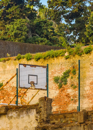 Decaying wall building and basket hood long distant urban shot, Montevideo, Uruguay