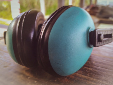Blue noise protective over wooden table headphonesの写真素材