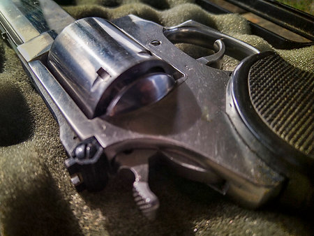 Revolve gun over padded box closeup detail shot