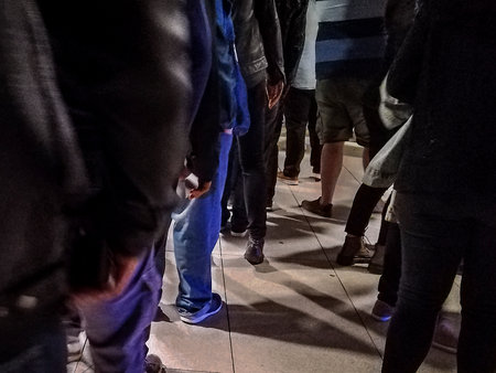 Montevideo, Uruguay; September 21 2022: High contrast night scene people waiting to enter to music...