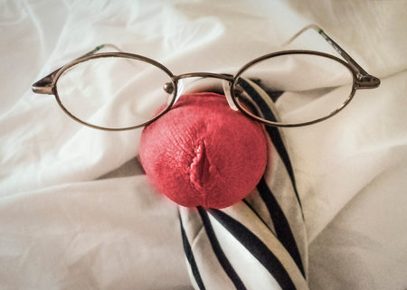 Top view shot man penis head with glasses over white blanket