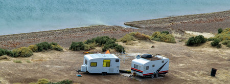 High angle shot caravans parked at cerro avanzado beach punta loma peninsula, puerto madryn, chubut province, argentinaの写真素材