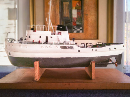 Side view wooden miniature fishing boat naval model cratfsmanshio exhibited at home roomの写真素材