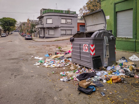 Garbage thrown away at street near container, montevideo, uruguay,の写真素材