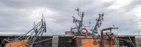 San Antonio Oeste, Argentina; January 14 2023: Ships commercal boats stranded at beach, san antonio...