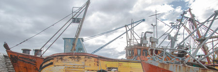 San Antonio Oeste, Argentina; January 14 2023: Stranded boats at beach, san antonio oeste town, rio negro province, argentinaの写真素材