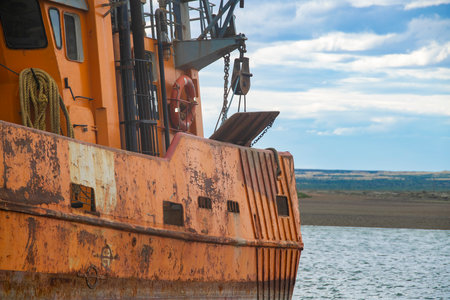 Commerical fishing ship stranded at beach, san antonio oeste town, rio negro province, argentinaの写真素材