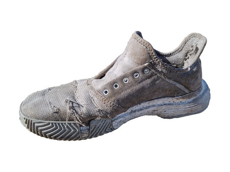 High angle shot wasted running shoe black and white isolated photoの写真素材