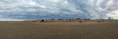Punta verde, Argentina; January 2 2023: Group of people at punta verde beach, at san antonio oeste...