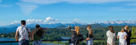 San Calors de Bariloche, Argentina; January 5 2023: People watching the view at circuito chico panoramic point, in san carlos de bariloche city, rio negro province, patagonia, argentinaの写真素材