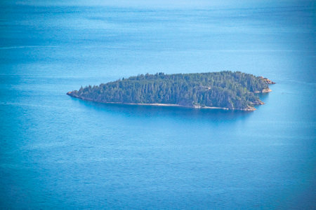 High angle view small forest island at nahuel huapi lake, san carlos de bariloche, rio negro province, argentinaの写真素材