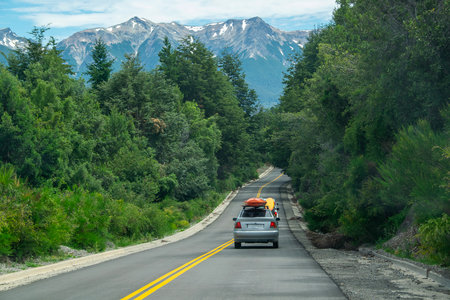 Highway surrounded by forest landscape at los alerces national park, a world heritage site located in chubut province, patagonia, argentinaの写真素材
