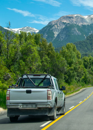 Highway surrounded by forest landscape at los alerces national park, a world heritage site located in chubut province, patagonia, argentinaの写真素材