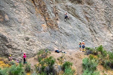 Young group practicing  sport climbing at caÃ±adon de la buitrera canyon, piedra parada town, patagonia, chubut province, argentinaの写真素材