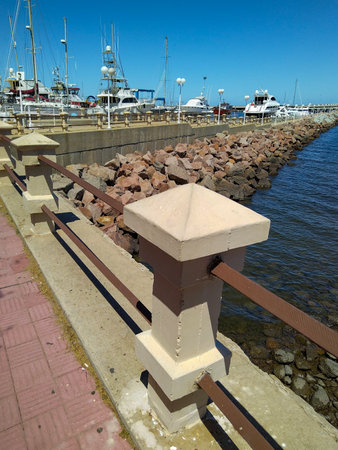 Wide shot cityscape view of piriapolis city boardwalk at summer sunny day, maldonado department, uruguayの写真素材