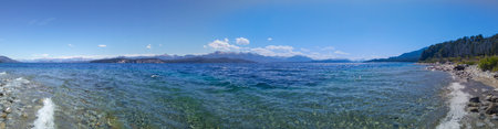Sunny summer day landscape at one of the beaches of bariloche, nahuel huapi national park, rio negro province, argentina.の写真素材