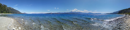 Sunny summer day landscape at one of the beaches of bariloche, nahuel huapi national park, rio negro province, argentina.の写真素材