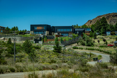 Contemporary style big houses in the middle of steppe Patagonian landscape, Rio Negro province, Patagonia, Argentinaの写真素材