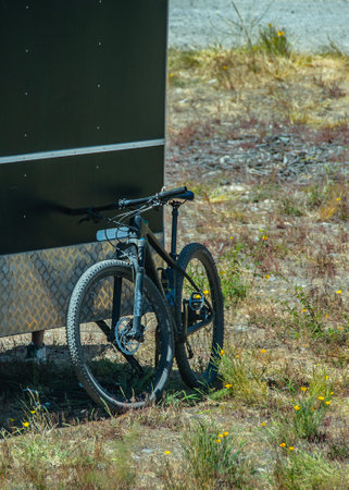 Zoom in detail view of black food truck and parked bicycle at outdoors landscape, negro province, patagonia, argentinaの写真素材