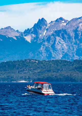 Boat crossing waters of nahuel huapi national lake, bariloche,  rio negro province, patagonia, argentina.の写真素材