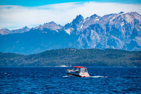 Boat crossing waters of nahuel huapi national lake, bariloche,  rio negro province, patagonia, argentina.の写真素材