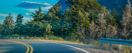Empty modern highway crossing patagonian landscape, rio negro province, patagonia, argentinaの写真素材