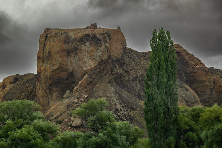 Highway point of view of rocky plateau landscape, los altares town, chubut province, patagonia, argentinaの写真素材