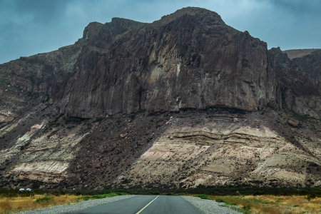 Driver point of view of rocky plateau landscape, los altares town, chubut province, patagonia, argentinaの写真素材