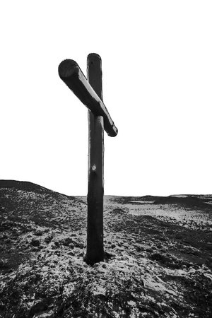 Black and white graphic wooden cross at top of hill isolated on blank backgroundの写真素材