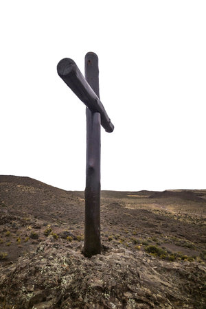 Wooden christian croos at top of hill isolated on blank background photoの写真素材