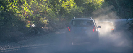 Car point of view of dust dirt road at los alerces national park, a world heritage site located in chubut province, patagonia, argentinaの写真素材