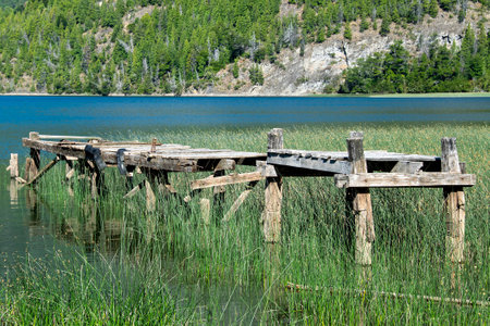 Abandoned broken wooden dock, los alerces national park, a world heritage site located in chubut province, patagonia, argentinaの写真素材