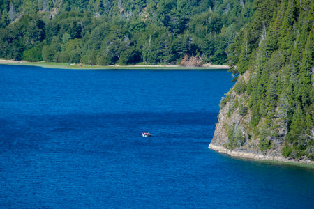 Quiet lake and forest at background landscape at los alerces national park, a world heritage site located in chubut province, patagonia, argentinaの写真素材