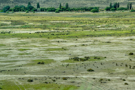 Aerial photography of arid steppe patagonia landscape with space vegetation, cushamen department, chubut province, argentinaの写真素材