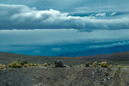Andes mountains covered by clouds at top, cushamen department, chubut province, argentinaの写真素材