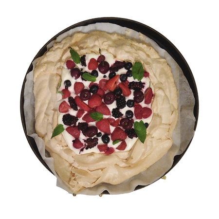High angle view cake topped with a variety of fresh berries, including strawberries, cherries, blackberries, and blueberries, along with a creamy white base and mint leaves for garnish.の写真素材