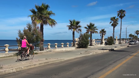 Piriapolis, Uruguay - January 5 2025: Wide shot urban sunny summer scene at waterfronnt boardwalk at piriapolis city, maldonado department, uruguayの写真素材