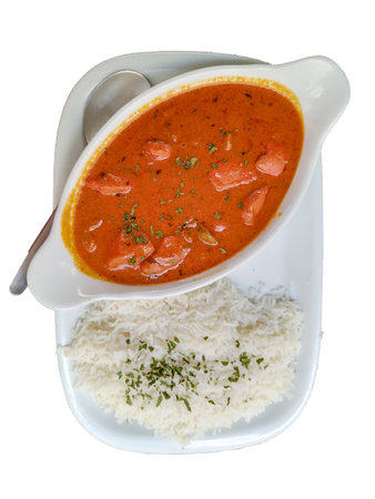 High-angle view of a cold rice salad with black olives, carrots, and parsley served on a ceramic plate. The clean presentation and natural light highlight freshness and healthy eatingの写真素材
