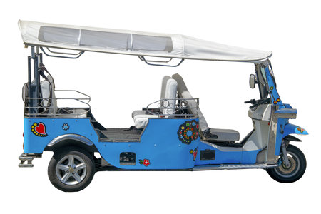 Front-side view of a small, open-sided electric vehicle isolated photoの写真素材