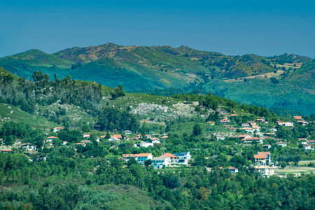 High-angle shot of a picturesque mountain village with houses clustered on forested slopes, fafe, braga district, portugalの写真素材