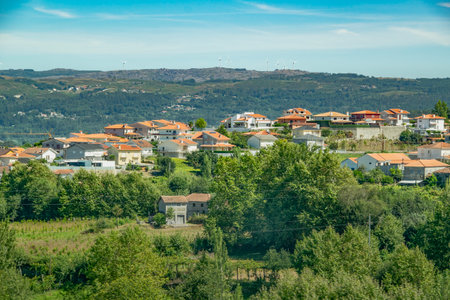 High-angle shot of a picturesque mountain village with houses clustered on forested slopes, fafe, braga district, portugalの写真素材