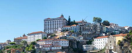 Front view shot of historic waterfront buildings at ribeira district in Porto city at summer time,...
