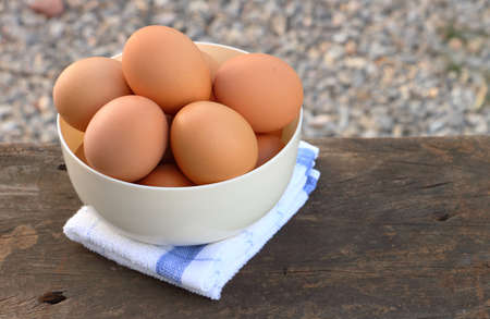 bowl of eggs on wood background