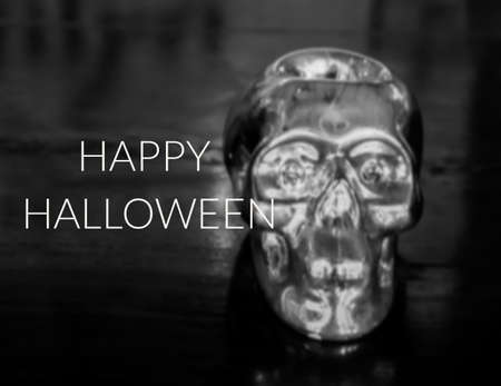 Silver skull on wood backgroundの写真素材