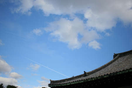 Kyoto's Sky and Airplane Clouds