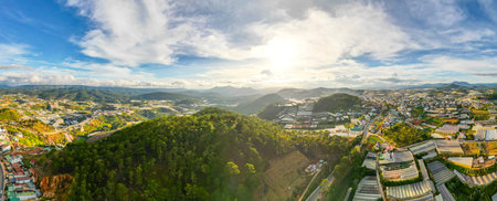 360 Panorama of Breathtaking Mountain Skyline in Da Lat City, Vietnam: A Stunning View of Cityscape and Majestic Mountains under the Blue Skyの写真素材