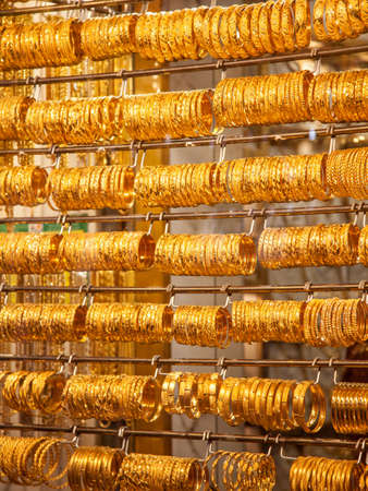 Gold bangles in a Dubai gold souk  United Arab Emiratesの写真素材