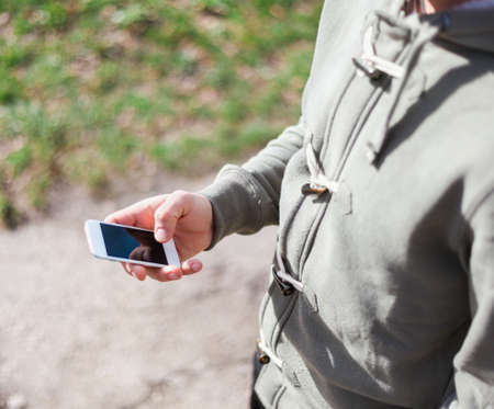 Close up of a young man using smartphoneの写真素材