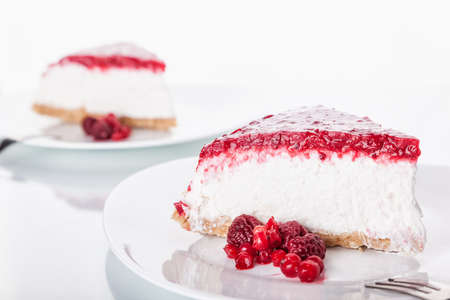 Slice of cheesecake with red fruitsの写真素材