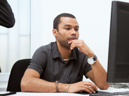 Portrait of successful businessman working in his officeaの写真素材